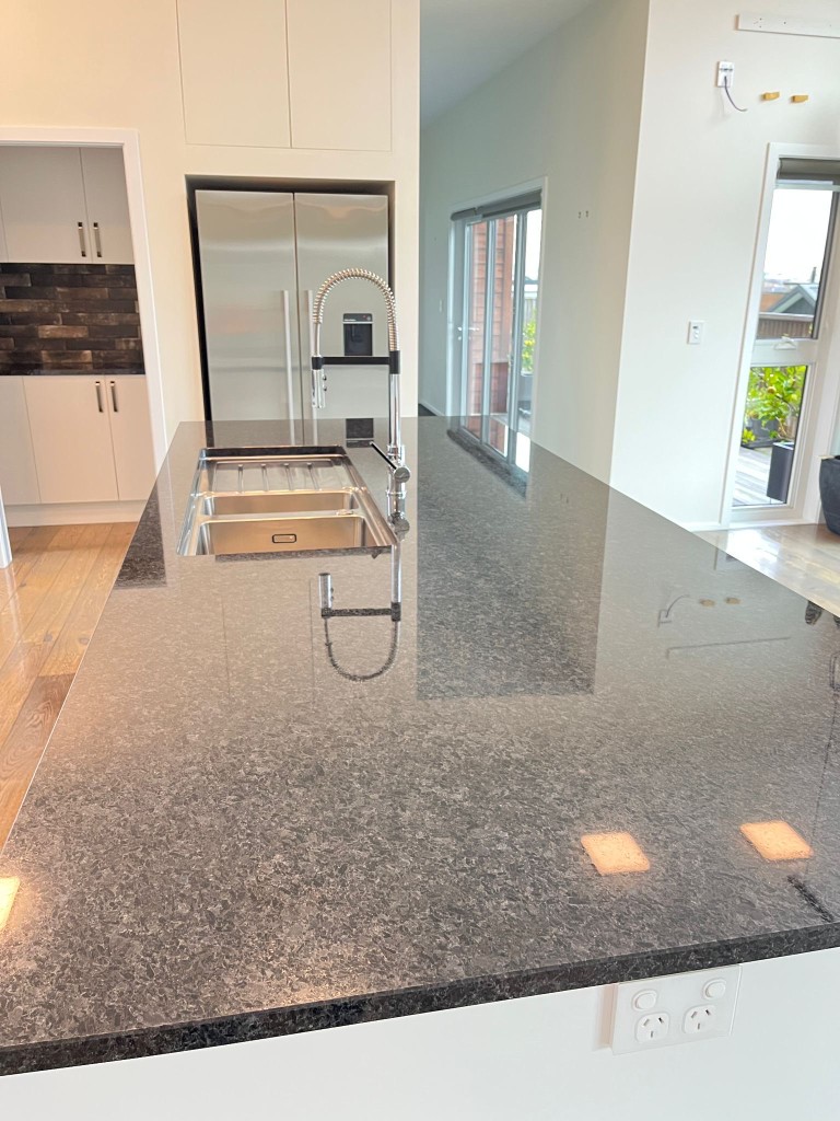 A clean kitchen island prepared by Alpine Shine